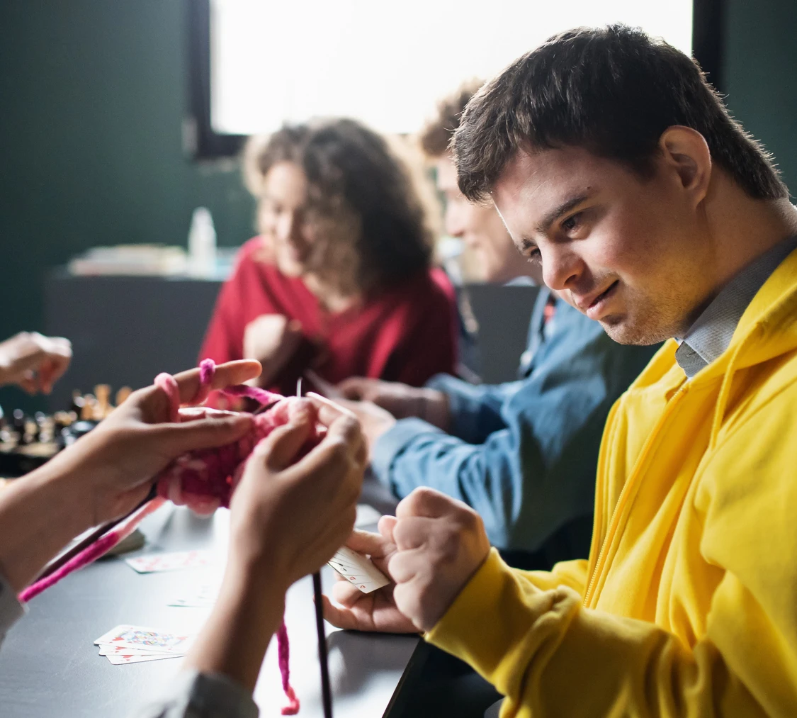 Disabled man in knitting class